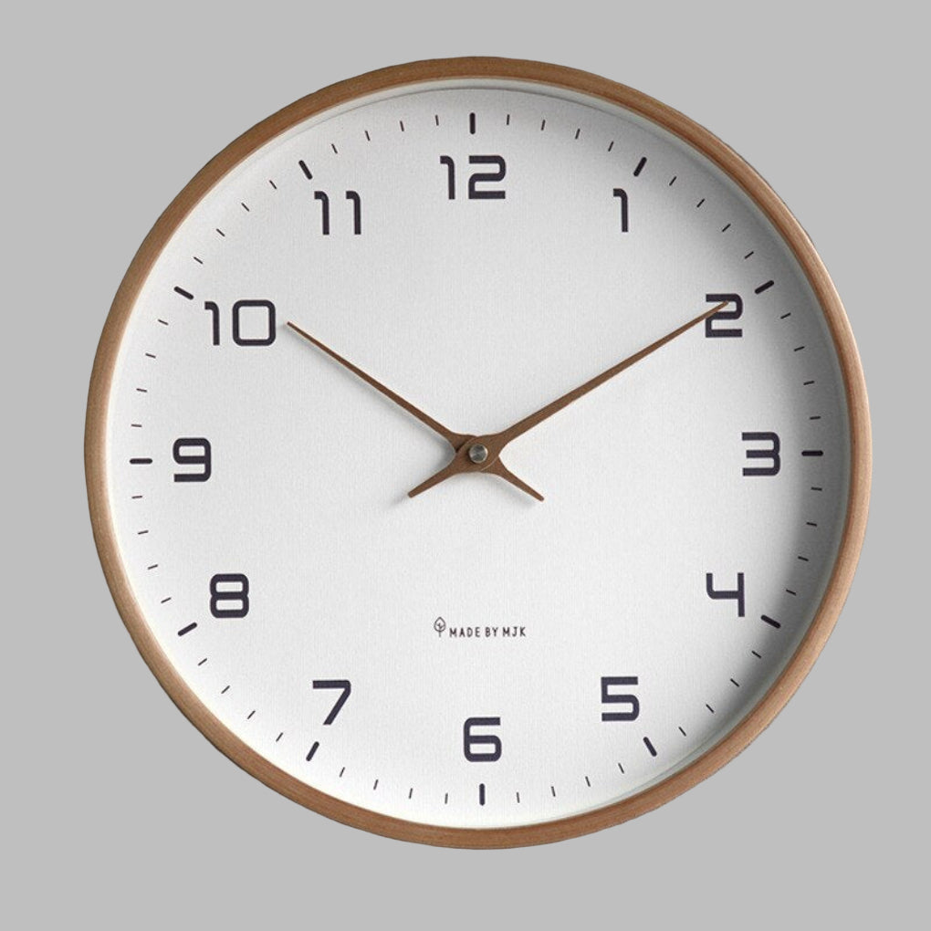 Minimalist wooden wall clock in a natural wood finish, perfect for modern Scandinavian home decor in living rooms.