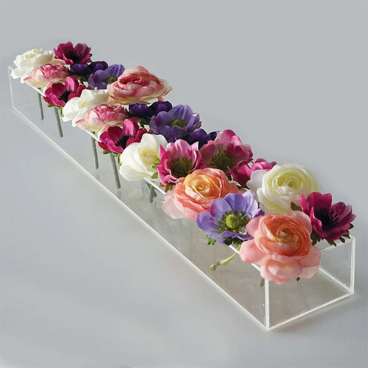 Minimalist clear acrylic flower vase, emphasizing clean lines for a sophisticated home or event look.