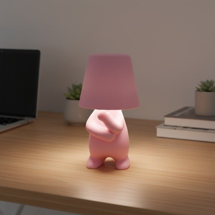 Rechargeable LED table lamp in a modern humanoid design, ideal for artistic ambient room lighting.