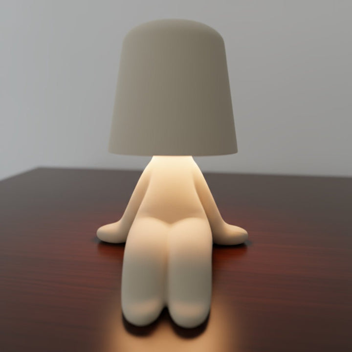 Contemporary humanoid LED desk lamp with flexible design, offering creative and ambient room lighting.
