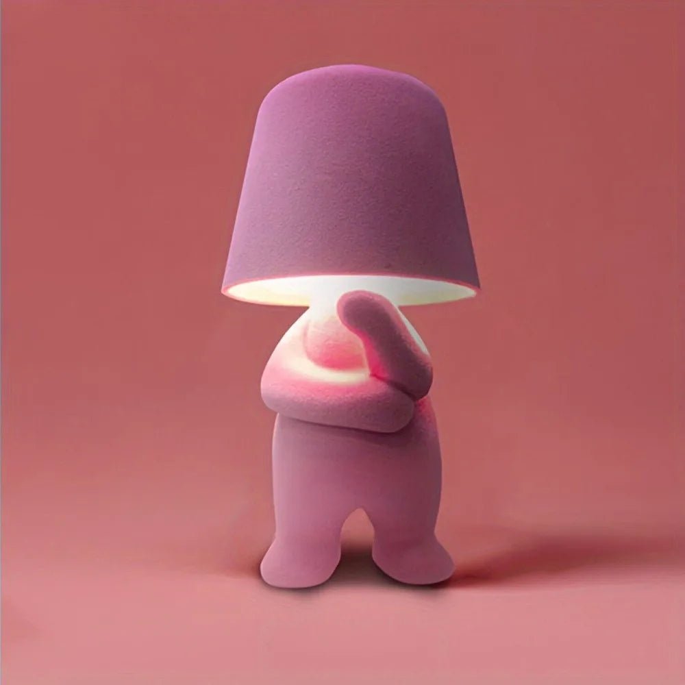 Modern LED desk lamp shaped like a humanoid figure, great for creative room lighting & home accents.