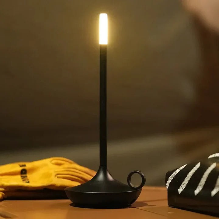 Modern LED touch table lamp, dimmable and rechargeable, wireless convenience for home or office accent lighting.