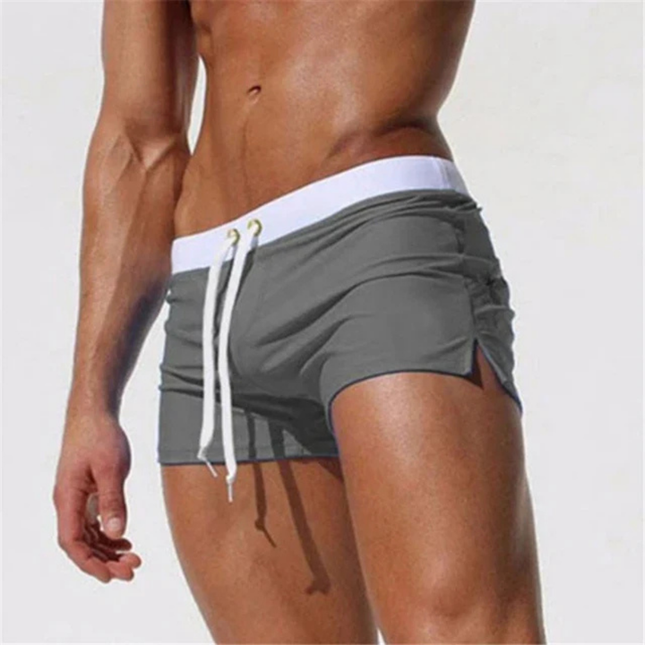 Athletic men's square cut swim trunks, ideal for active swimming, beach sports & pool.