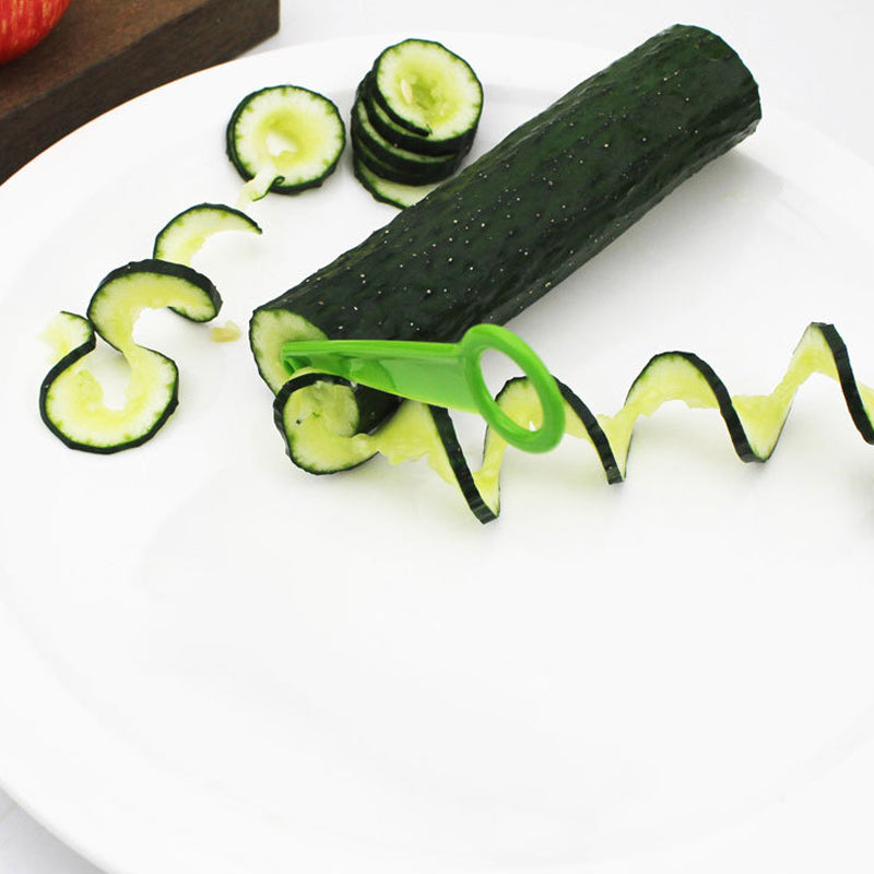 Stainless steel vegetable peeler and shredder, a versatile kitchen cooking tool