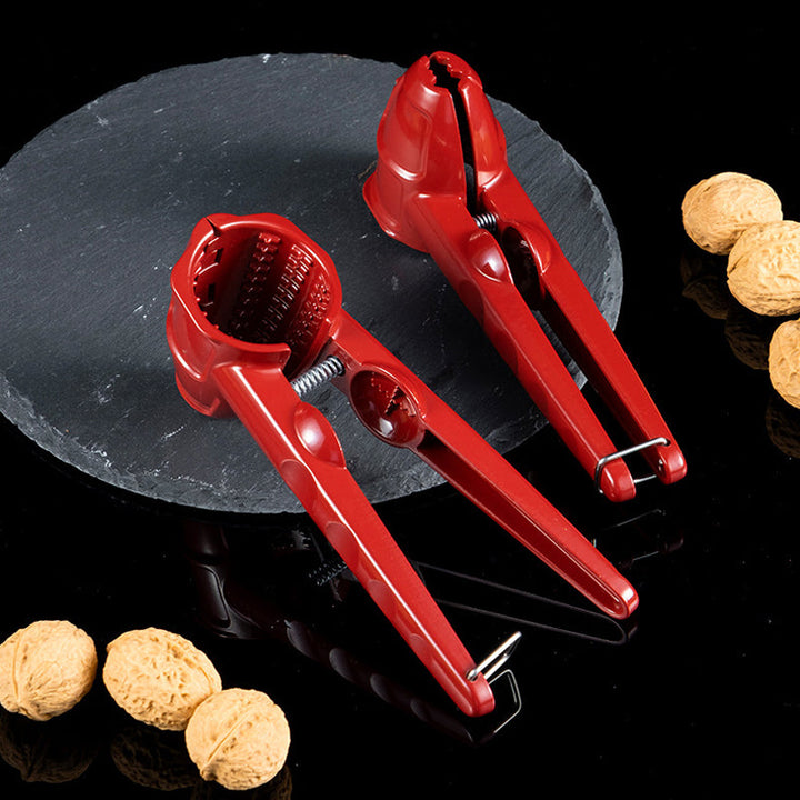 Aluminum nutcracker gadget, household nut opener. Efficiently cracks various nuts, ergonomic design.