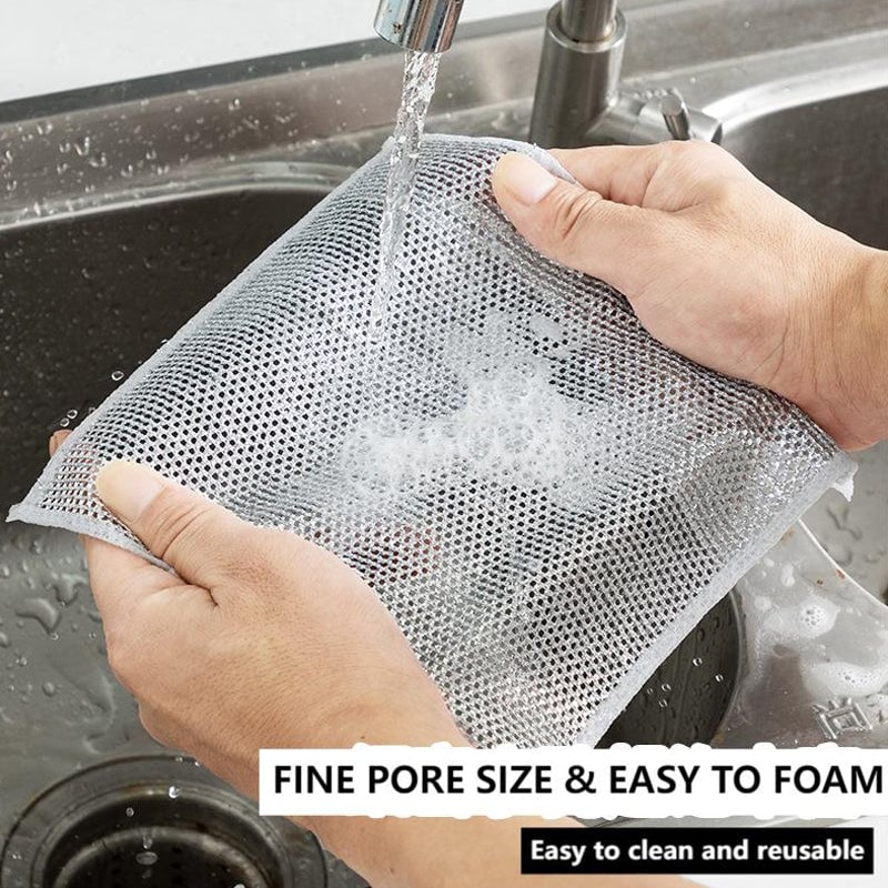 Non-scratch wire dishcloth in use on a cookware pan, effectively removing grime