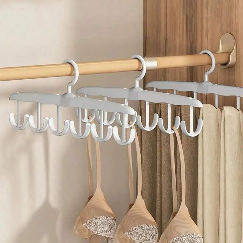Portable plastic clothes hanger with a 360-degree rotating hook, suitable for travel and home use