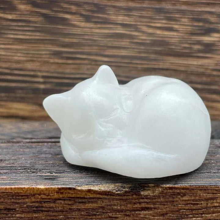 Peaceful natural stone sleeping cat sculpture, enduring beauty, ideal home accent or garden ornament