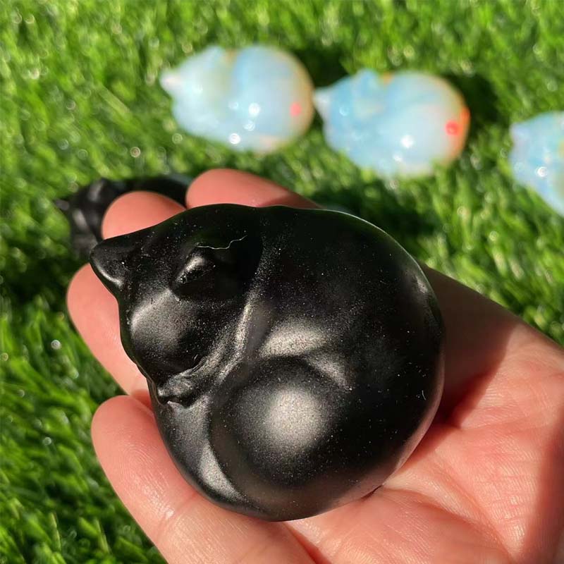 Sleeping cat sculpture crafted from natural stone, 3D animal figurine, ideal for garden or desk