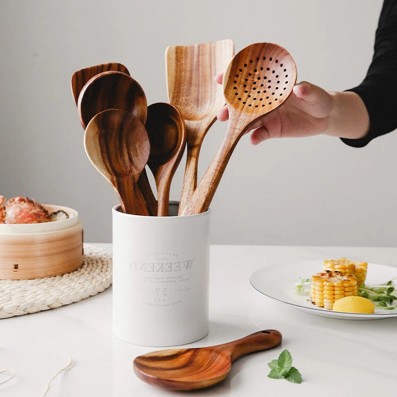 Versatile teak wood cooking tools, including spoons & spatulas, perfect for safe use on all non-stick cookware.