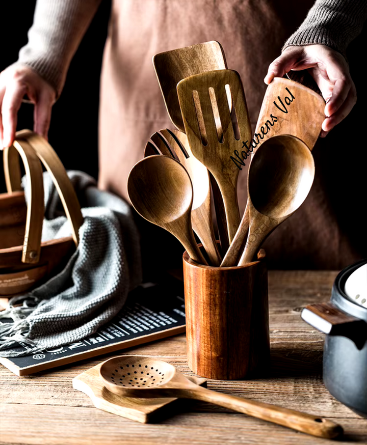 Natural teak wood cooking utensil collection. Eco-friendly, durable wooden tools for a healthy kitchen.