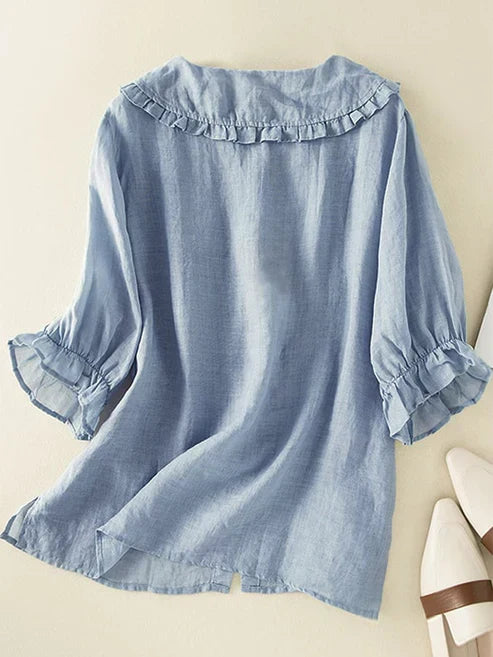 Loose-fit women's casual shirt with a stylish Peter Pan collar & ruffle neck, ideal for comfortable summer fashion.