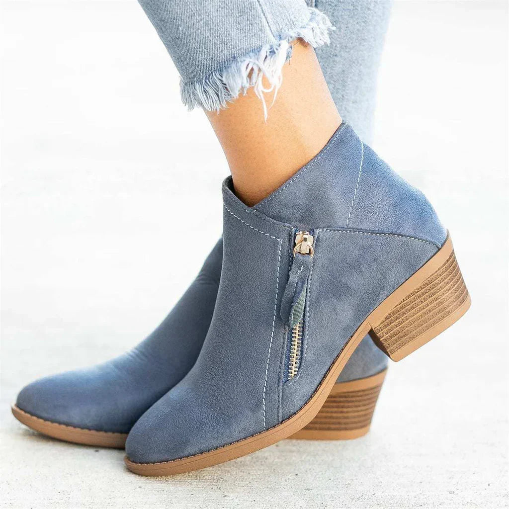 Close-up of Women's Stylish Zip Heel Boots, showcasing quality material & strong zipper detail
