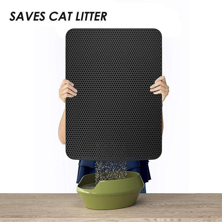 Cat stepping onto a black non-slip litter trapping mat, highlighting its comfort and pet cleaning use
