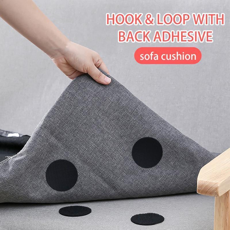 Non-slip rug gripper anchors keeping a grey rug securely in place on a hardwood floor.