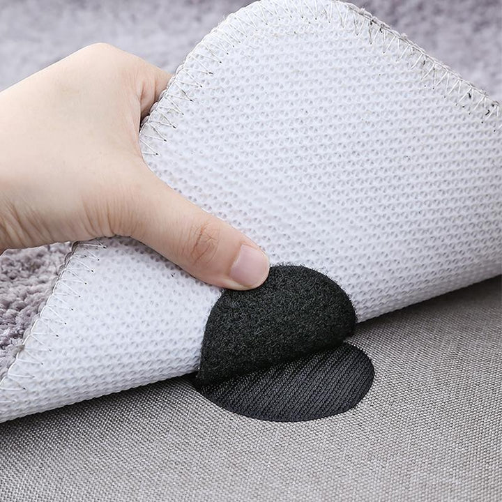 Pack of multi-surface rug grippers and carpet anchors for enhanced household safety.