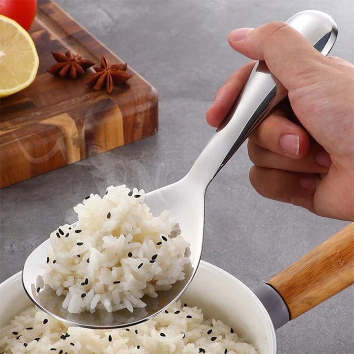 Close-up of a non-stick stainless steel rice serving spoon, sleek design for home goods