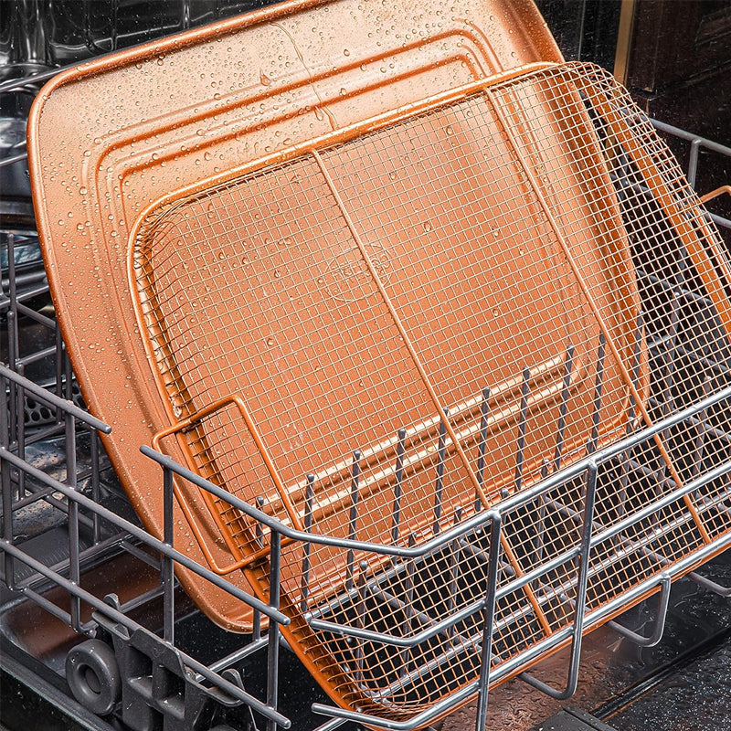 Nonstick air fryer basket and crisper tray on a kitchen counter, ready for cooking