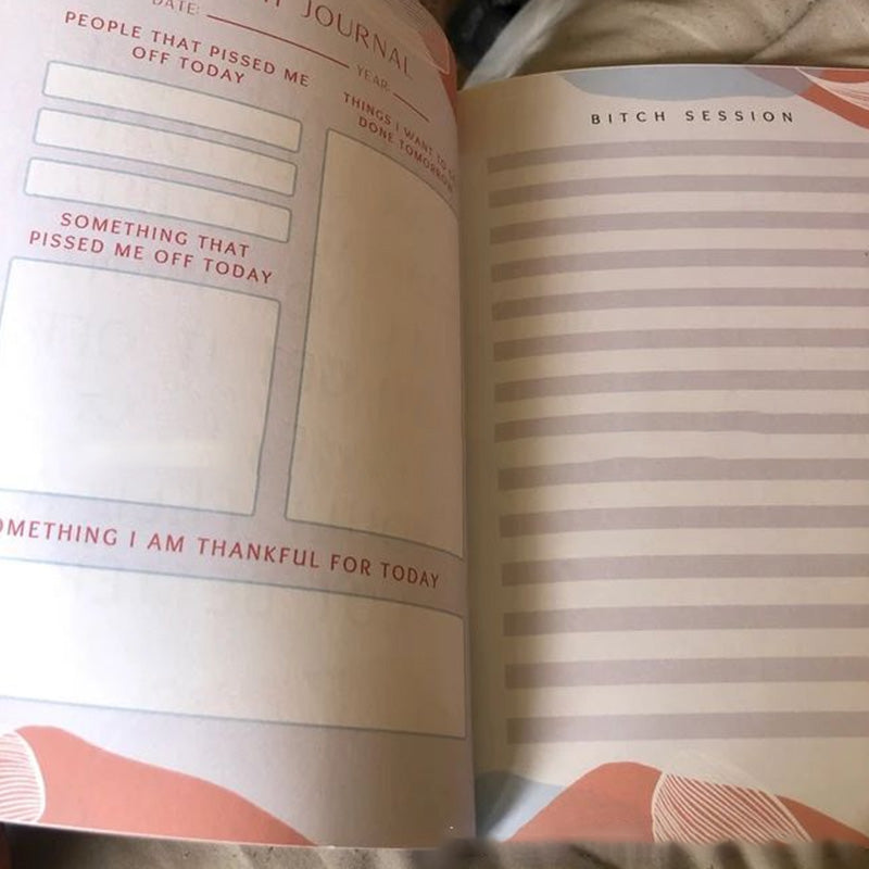 Close-up of a page in an adult stress relief journal showing a prompt