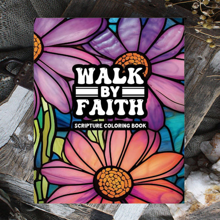 Detailed shot of an adult coloring book page depicting a serene landscape with an uplifting Bible verse.