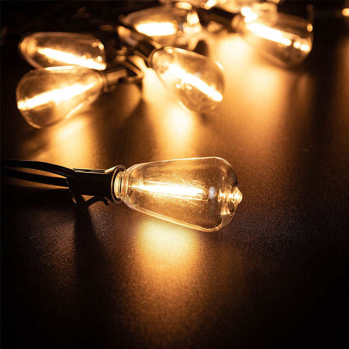 Multiple strands of connectable LED string lights illuminating a spacious deck