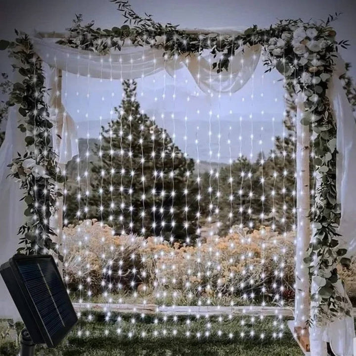 Vibrant multicolor LED solar curtain lights, perfect for festive outdoor and backyard decor, energy efficient.