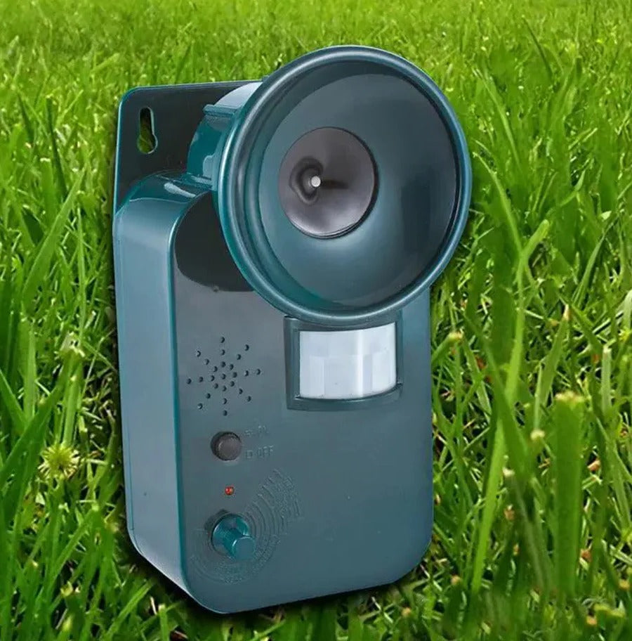 Outdoor ultrasonic animal deterrent with motion sensor, protecting up to 5,000 sq ft of garden.