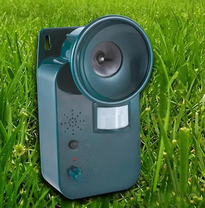 Outdoor ultrasonic animal deterrent with motion sensor, protecting up to 5,000 sq ft of garden.