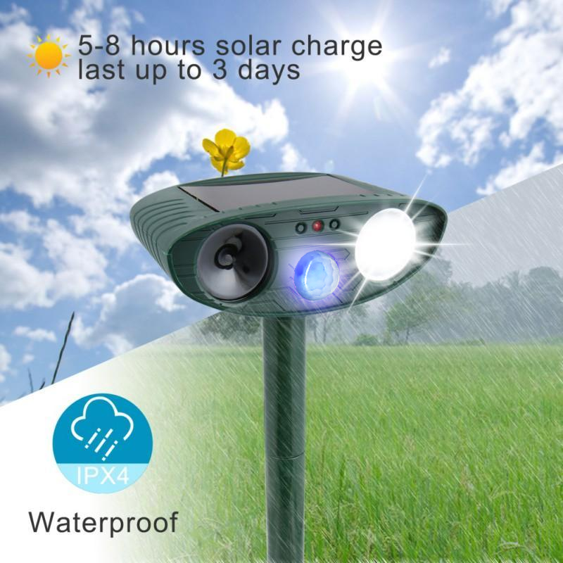 Close-up of an outdoor ultrasonic deer repeller, a solar-powered humane animal deterrent.
