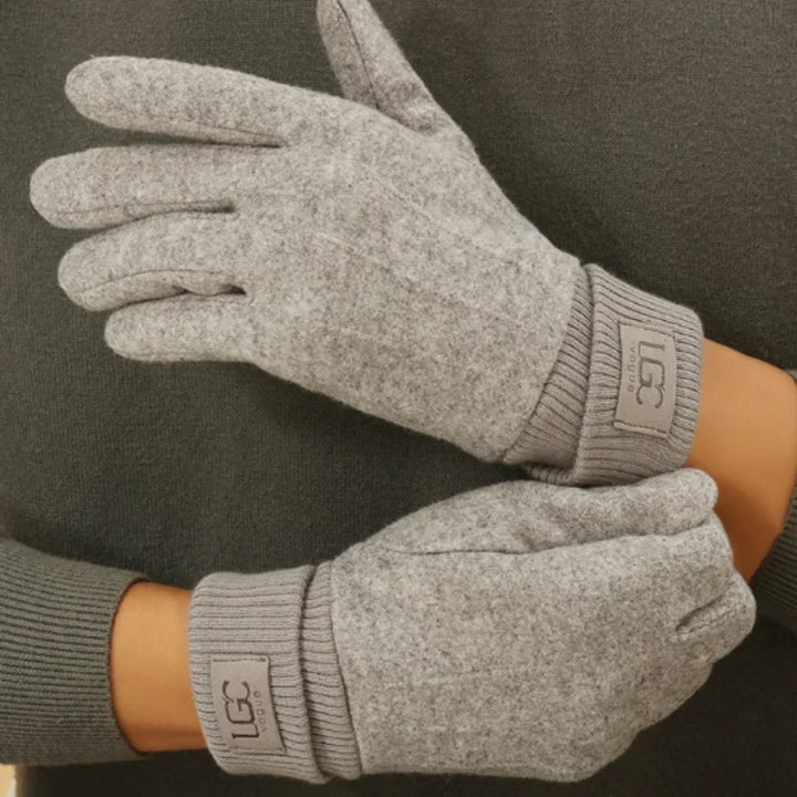 Side view of a hand in a grey cashmere touchscreen glove, showing the fitted wrist.
