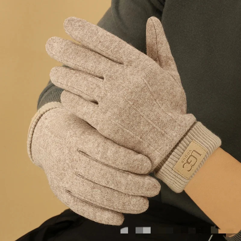 Detail shot of the soft cashmere fabric texture on a touchscreen winter glove.
