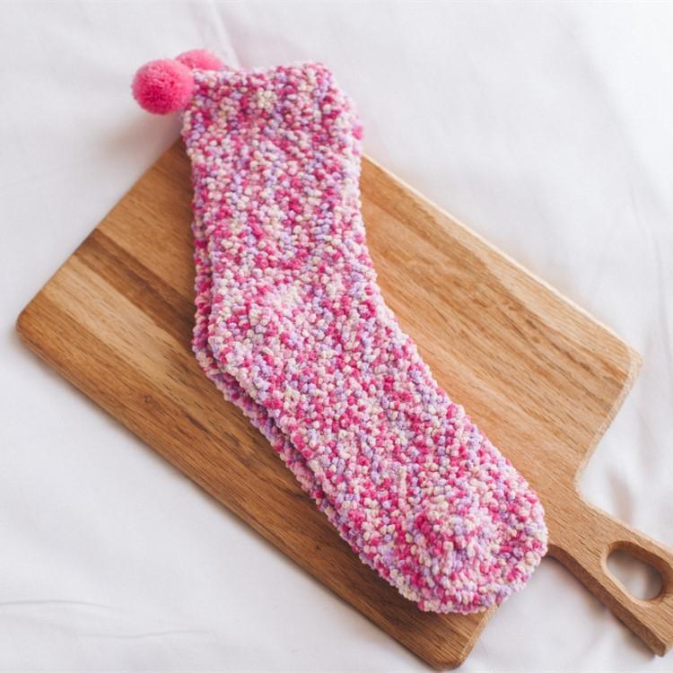 Brightly lit image of women's fluffy cupcake slipper socks, showcasing their vibrant colors and softness.