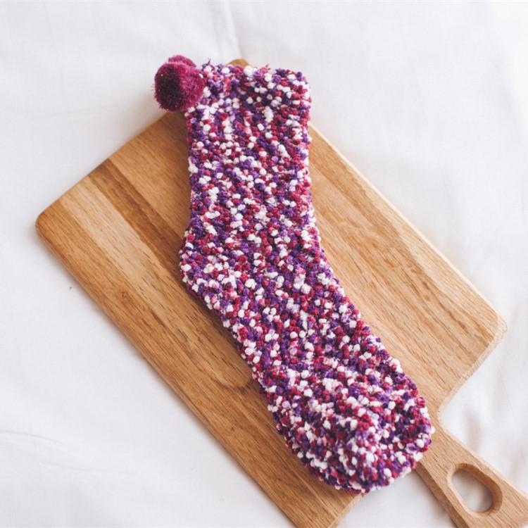 Pair of women's fluffy cupcake slipper socks, a unique and comfortable gift idea for her.