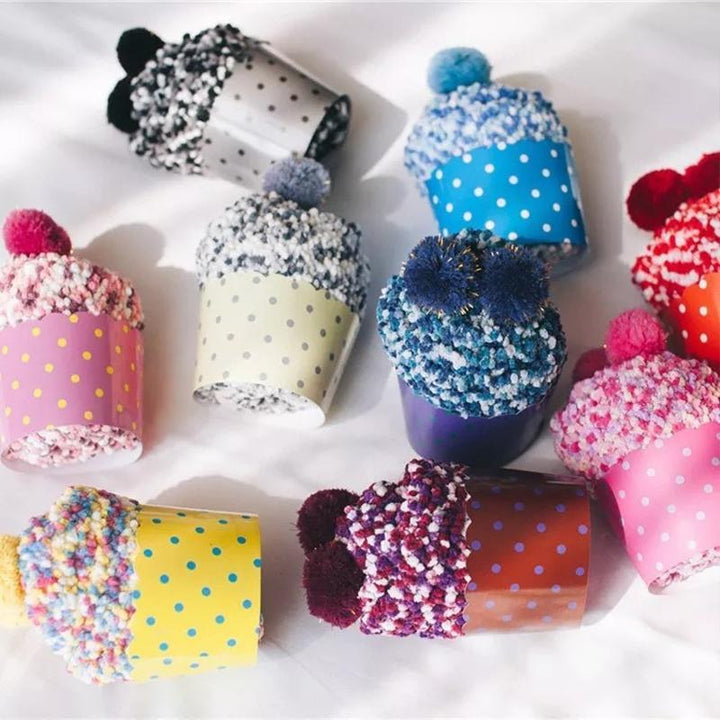Women's fluffy slipper socks designed as cupcakes, displayed folded with a bow, ideal Christmas gift.