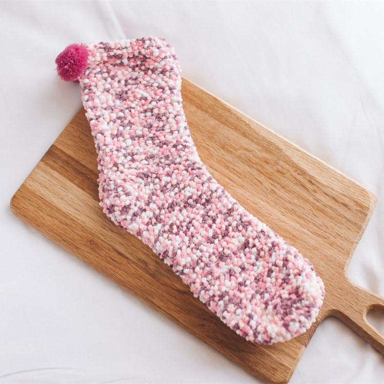 Top-down view of women's fluffy cupcake slipper socks, showing the full 'cupcake' design from above.
