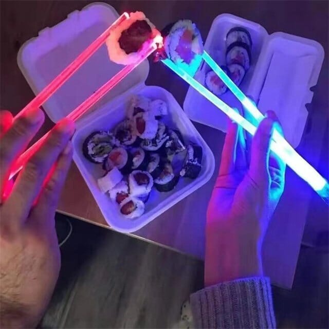Luminous blue LED chopsticks, designed as mini lightsabers, ideal for kitchen or novelty gift.