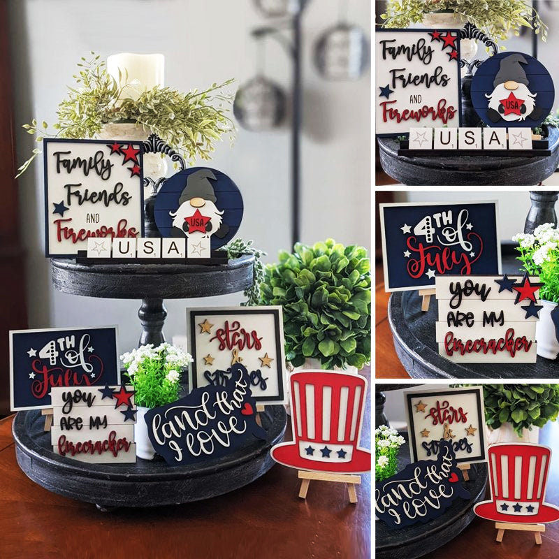 Hand-painted wooden signs with patriotic themes from an Americana tiered tray decor assortment.
