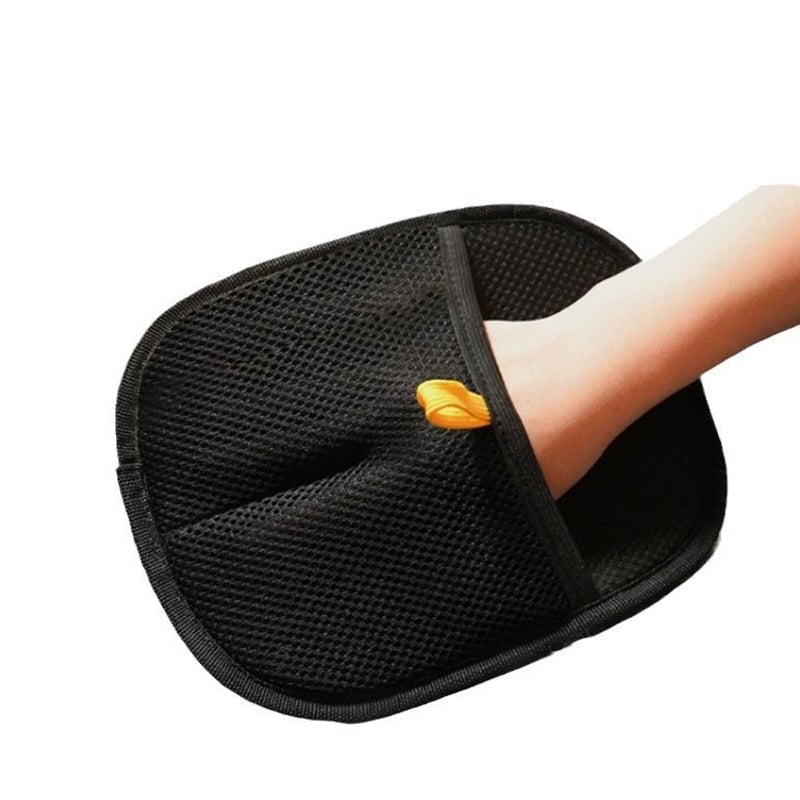 Happy dog being brushed with the hair removal glove, promoting healthy coat