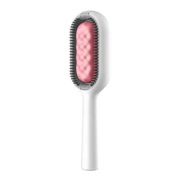 Full view of the pet hair removal comb and its translucent water tank.