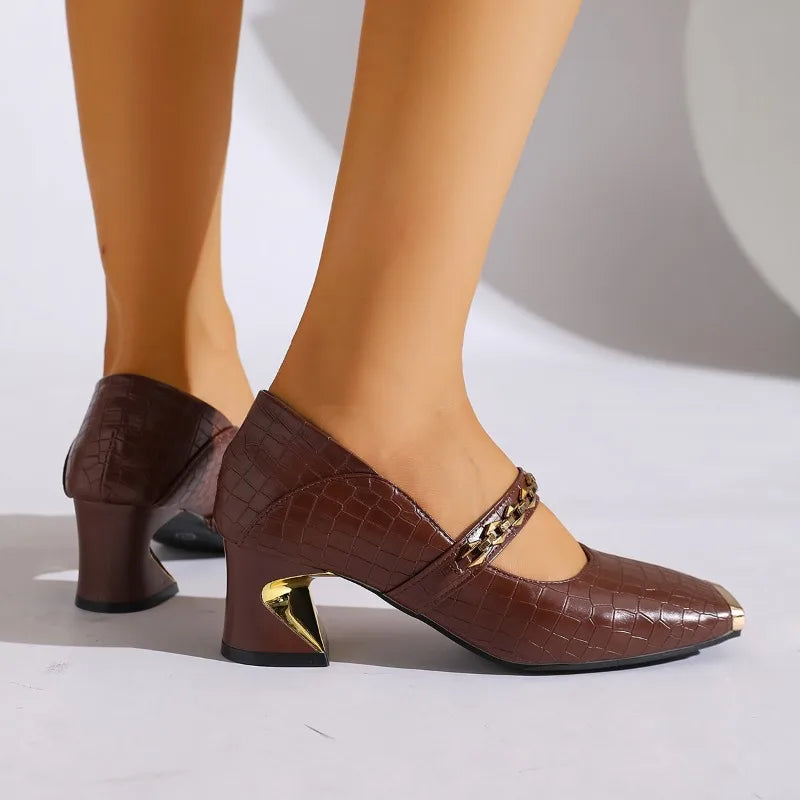 Fashionable red block heel pumps for women, with a unique chain detail and comfortable block heel.