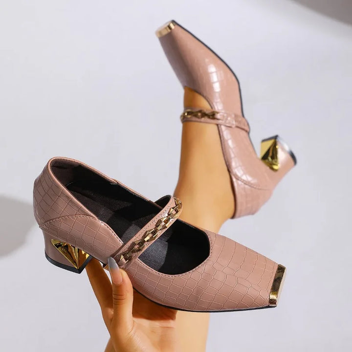 Elegant black block heel pumps for women with subtle chain detail, suitable for dressy occasions.