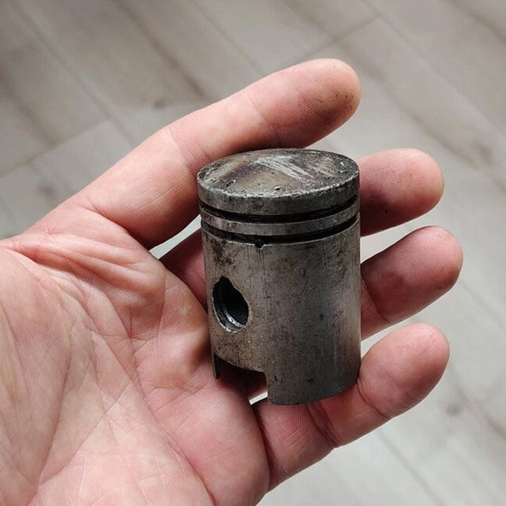 Unisex skull and piston keychain with bottle opener, perfect gift for motorcycle fans.