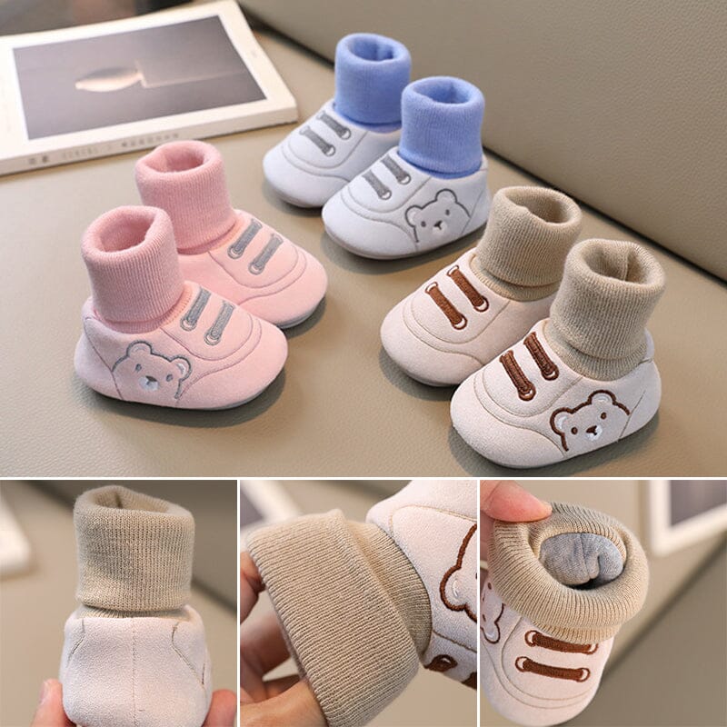 Plush pink baby booties with soft sole, perfect warm winter shoes for infants