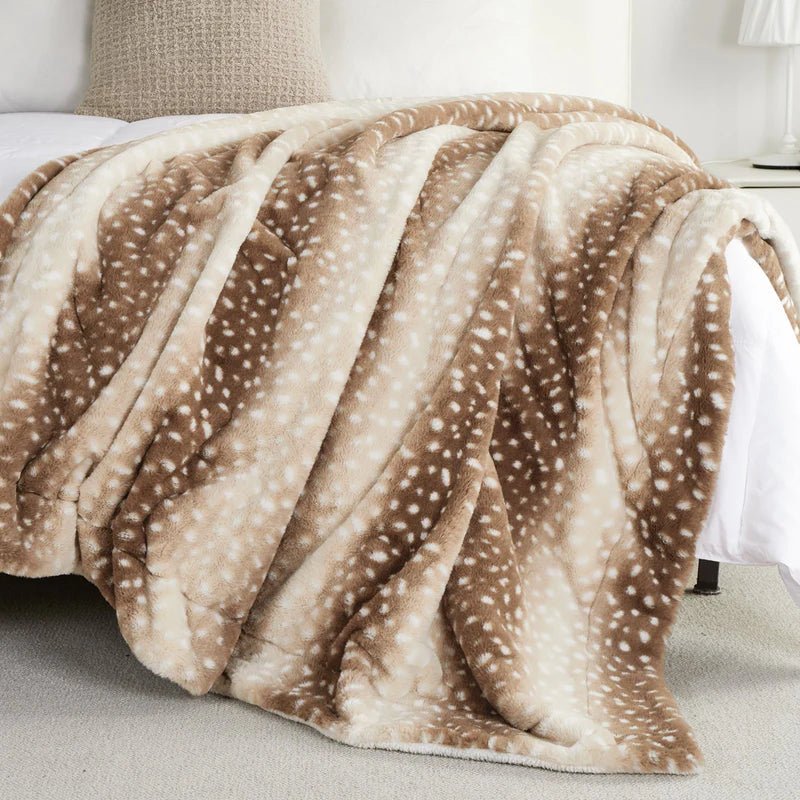Reversible faux fur deer blanket showing smooth reverse side, plush cozy throw for versatile bedroom decor.