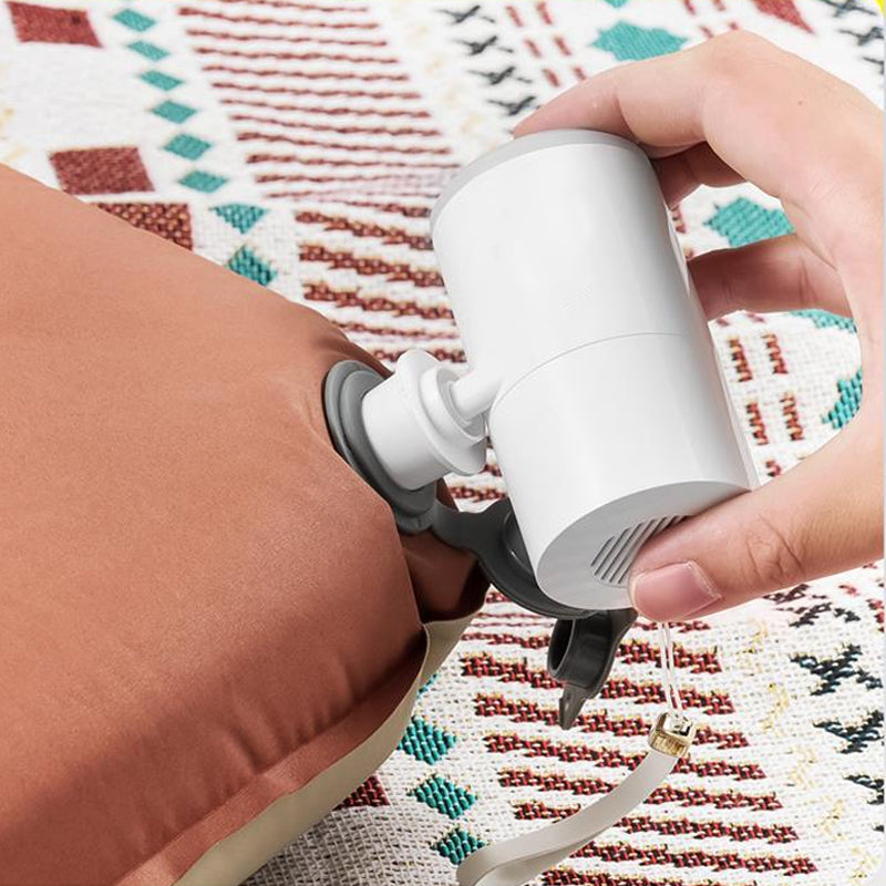 Two-in-one outdoor tool: compact air pump and camping lantern for all your adventure needs.