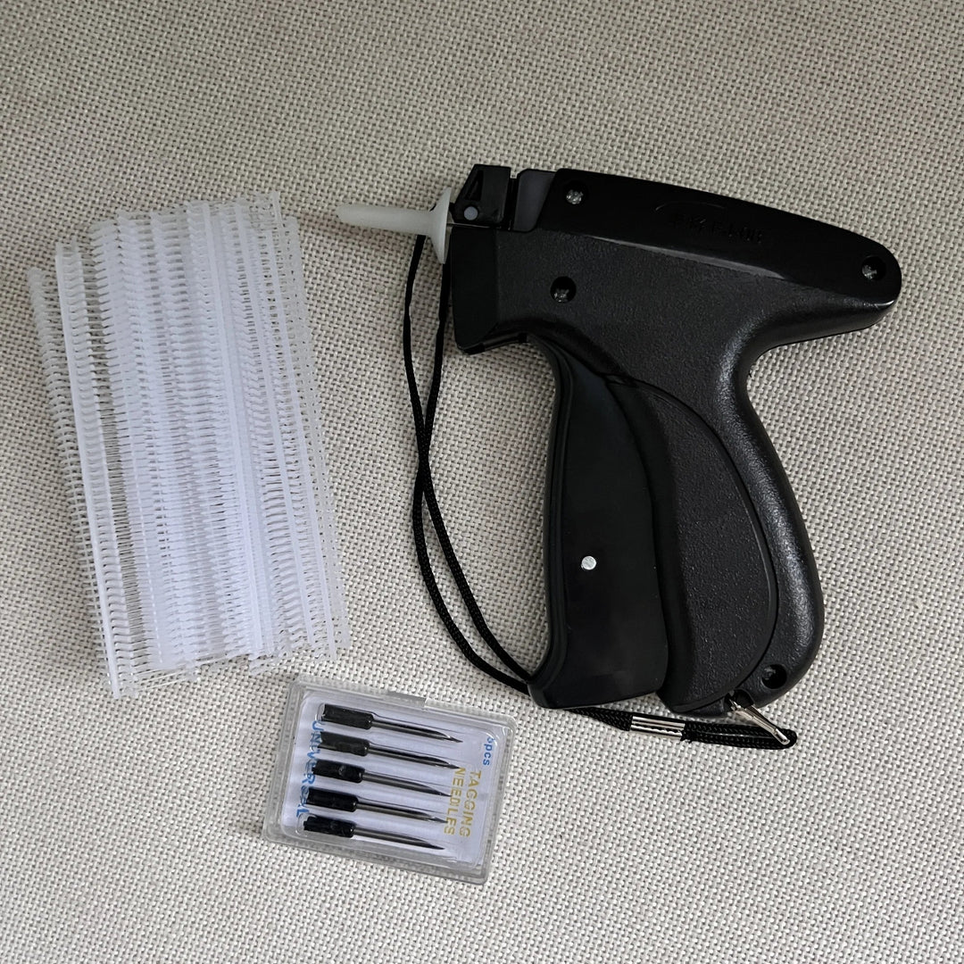Detail shot of the needle and fastening mechanism of the portable sewing tool for clothing