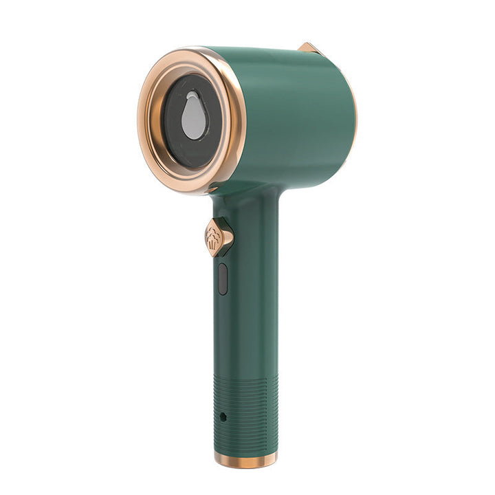 Mini iron and handheld steamer with various attachments, offering versatile fabric care solutions.