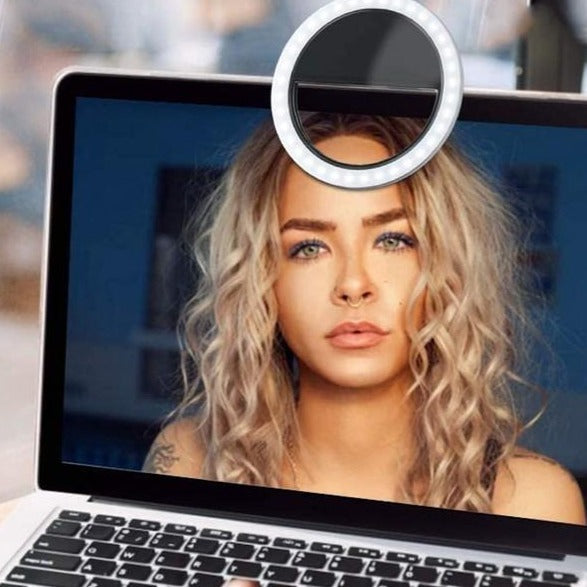 Versatile portable LED ring light for smartphones, offering adjustable brightness for professional-looking content creation.