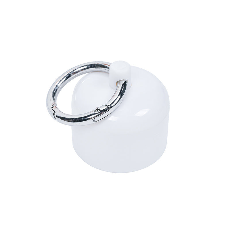 Mini cylindrical keychain organizer, shown open revealing its internal storage space