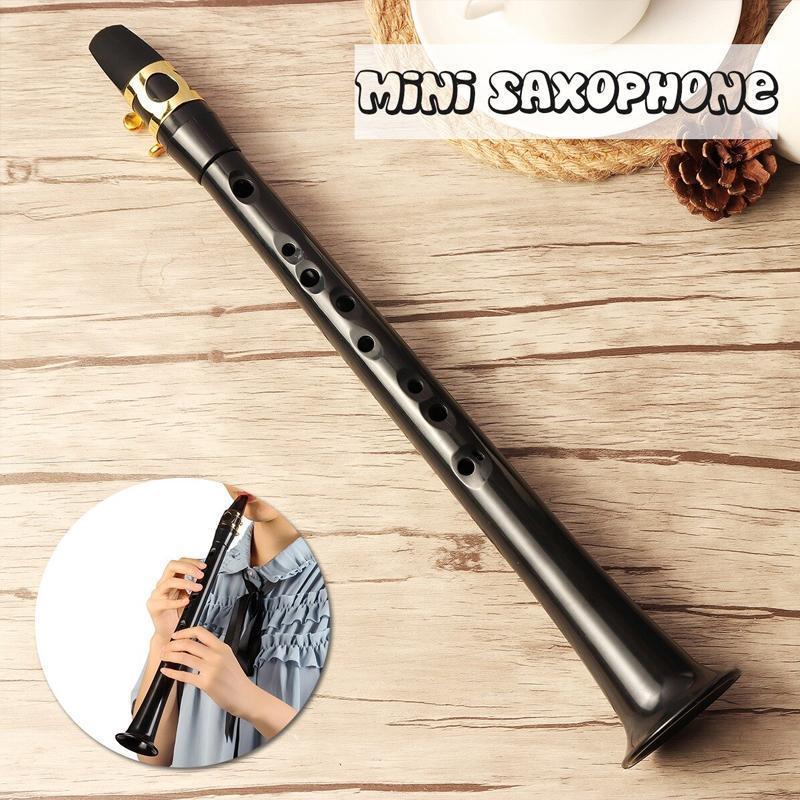 Compact ABS saxophone, a portable wind instrument suitable for adults and children learning music.